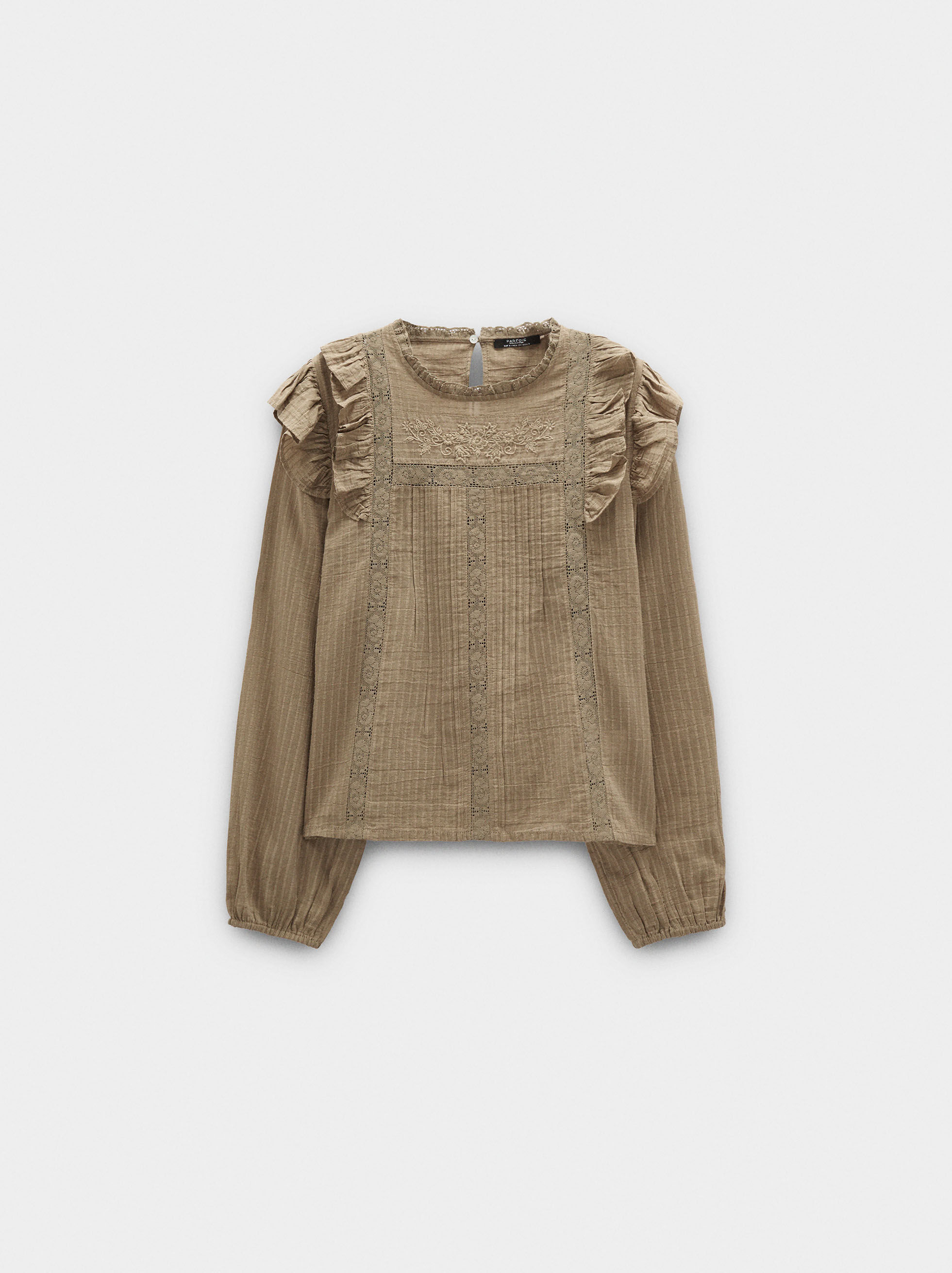 Blusa con ricami e volant